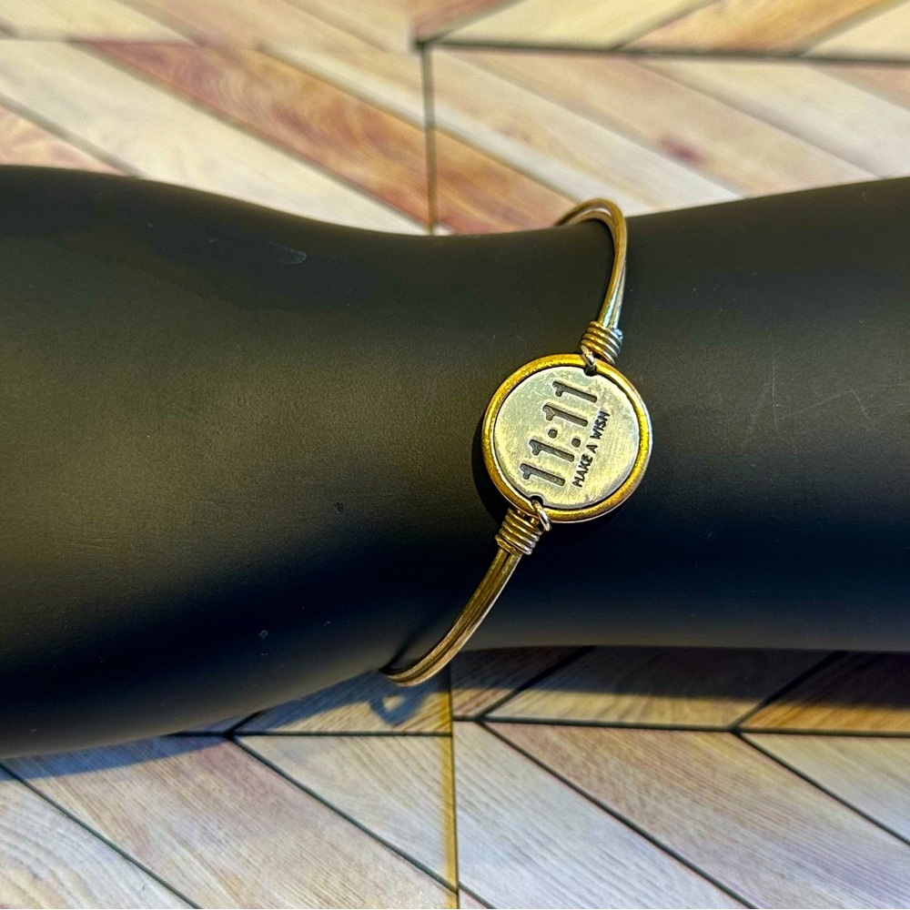 Luca and Danni Make a Wish Bangle with a brass finish.